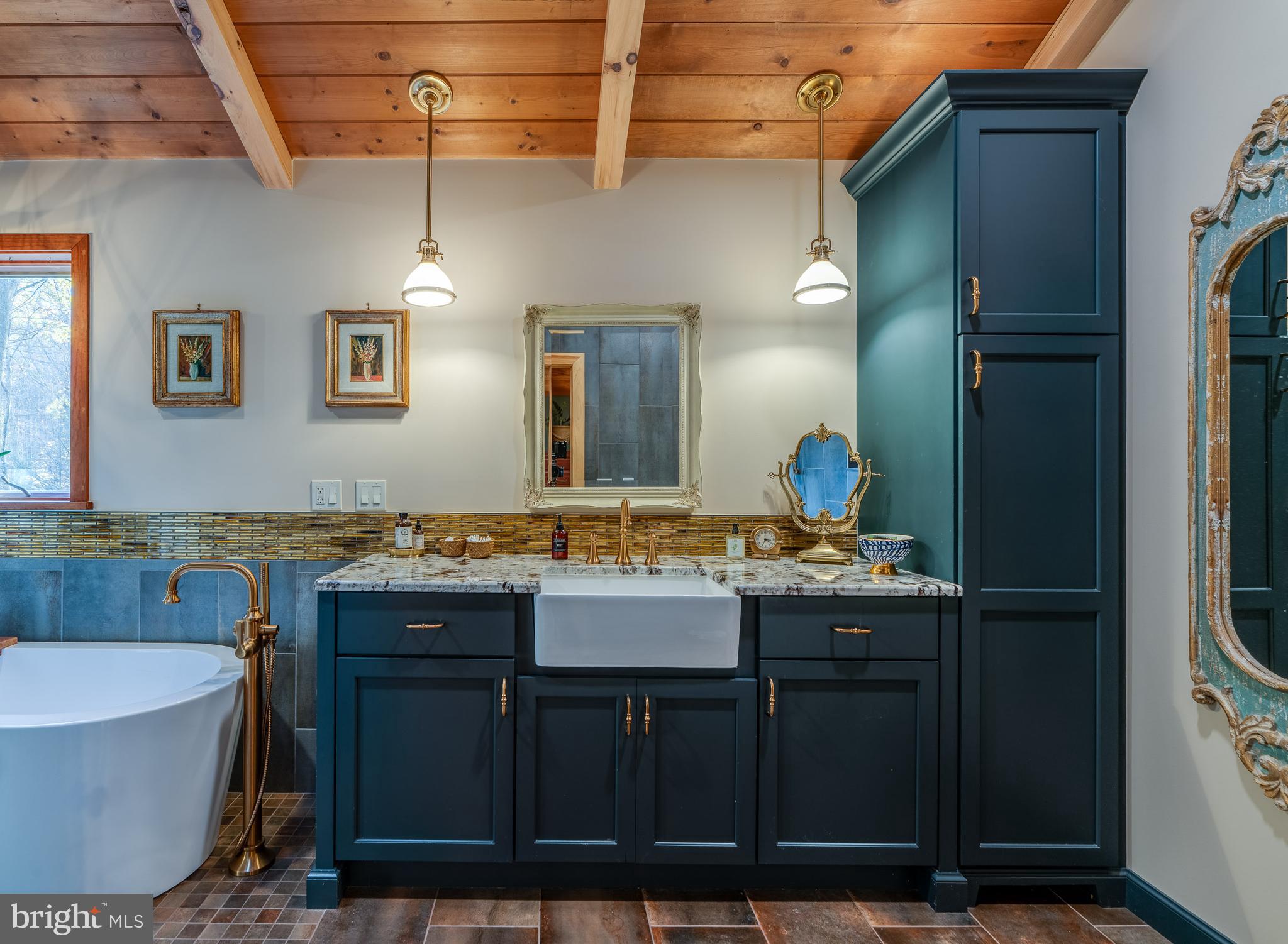 181 Old Mine Road Lebanon, PA 17042 - Photo 41 of 79 a bathroom with a granite countertop sink a mirror and a bathtub