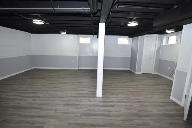 a bathroom with a shower a sink and a mirror