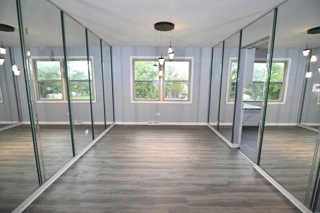 a bathroom with a sink mirror vanity and toilet