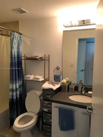 a bathroom with a sink and mirror