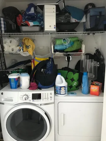a view of a livingroom with furniture and staircase