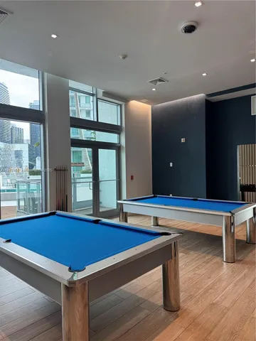 a kitchen with granite countertop a stove and a window