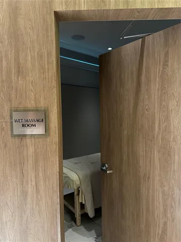 a bedroom with a bed and a mirror