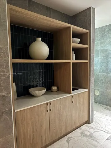 a bathroom with a large tub sink and mirror