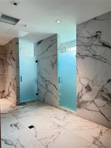 a view of a kitchen with wooden cabinet