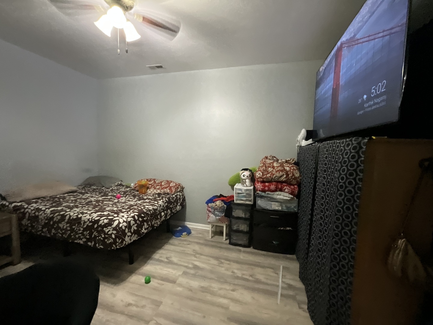 4226 West Ogden Avenue Chicago, IL 60623 - Photo 18 of 20 a bedroom with a bed and a chandelier