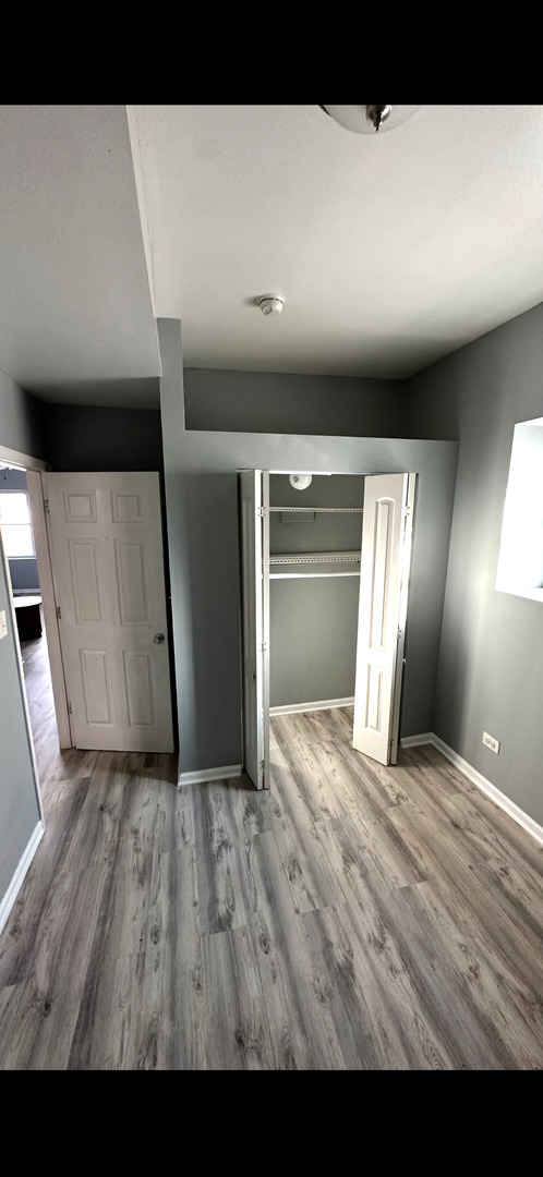 4226 West Ogden Avenue Chicago, IL 60623 - Photo 2 of 20 a view of empty room with wooden floor