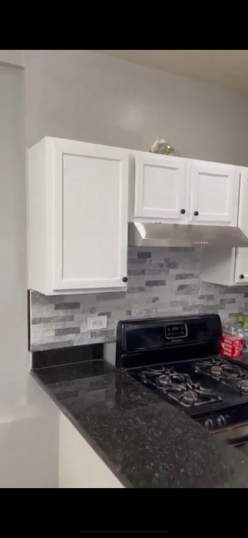 4226 West Ogden Avenue Chicago, IL 60623 - Photo 8 of 20 a bathroom with a sink and a mirror