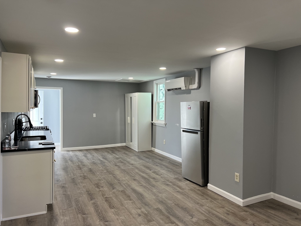 99 Chelsea Street, Unit 3 Boston, MA 02128 - Photo 4 of 10 a kitchen with a refrigerator and a sink