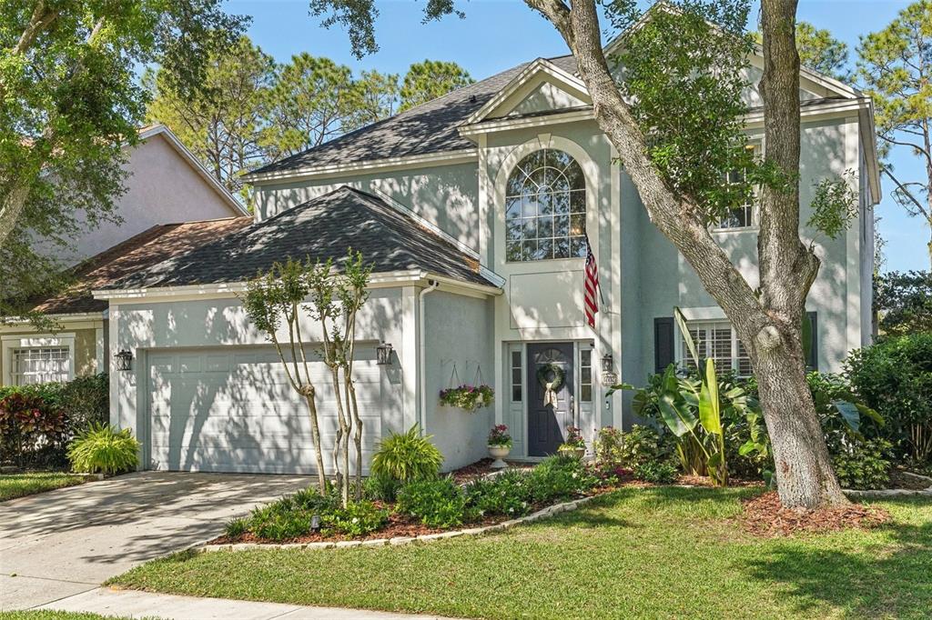 17712 Long Ridge Road Tampa, FL 33647 - Photo 1 of 1 a front view of a house with garden
