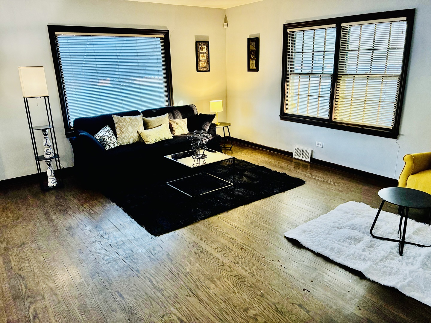 14506 Clinton Street Harvey, IL 60426 - Photo 2 of 12 a bed sitting in a bedroom next to a window
