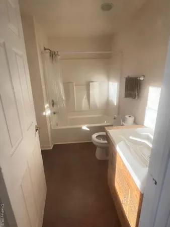 a bathroom with a sink a toilet and a bathtub