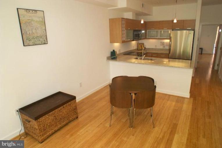 2029 13th Street Northwest, Unit 2 Washington, DC 20009 - Photo 2 of 7 a view of kitchen with wooden floor