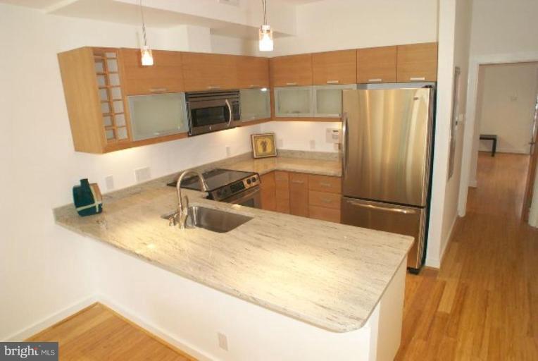 2029 13th Street Northwest, Unit 2 Washington, DC 20009 - Photo 3 of 7 a bathroom with a sink and a mirror