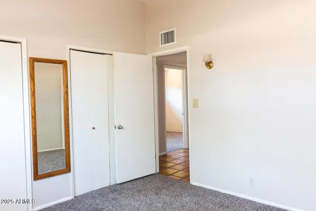 a bathroom with a sink toilet and mirror
