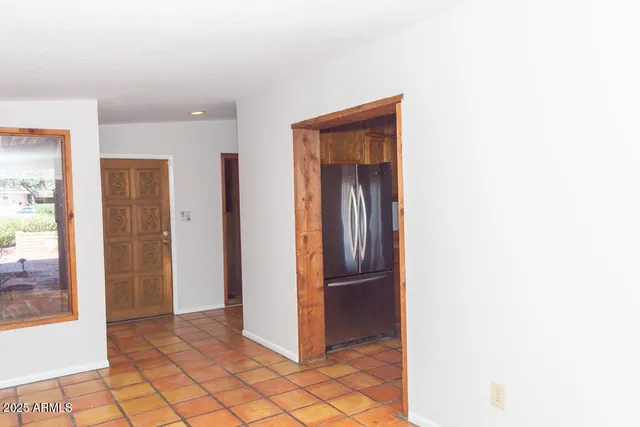 a view of a kitchen from the hallway