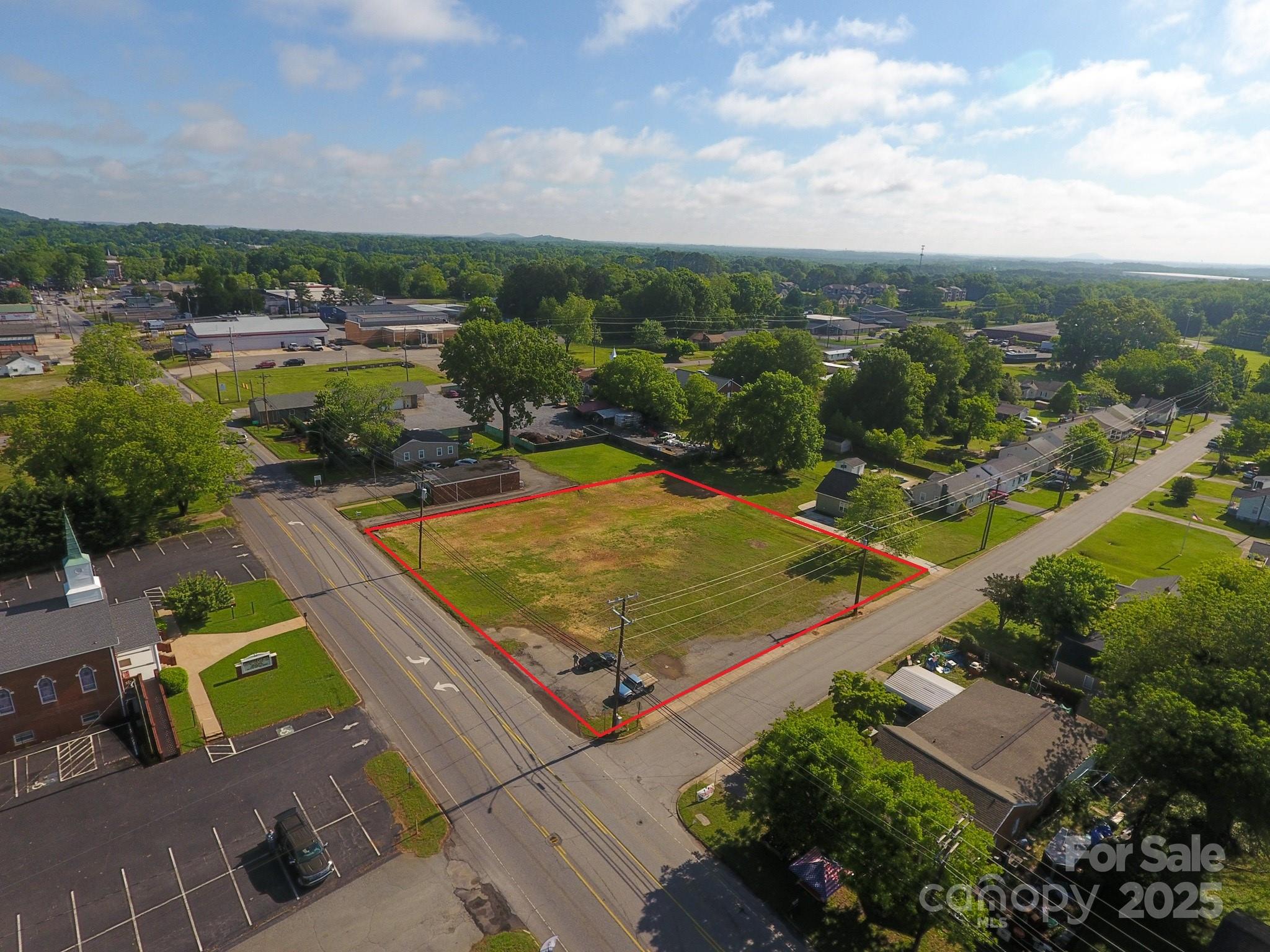 309 York Road Kings Mountain, NC 28086 - Photo 1 of 9 an aerial view of residential houses with outdoor space