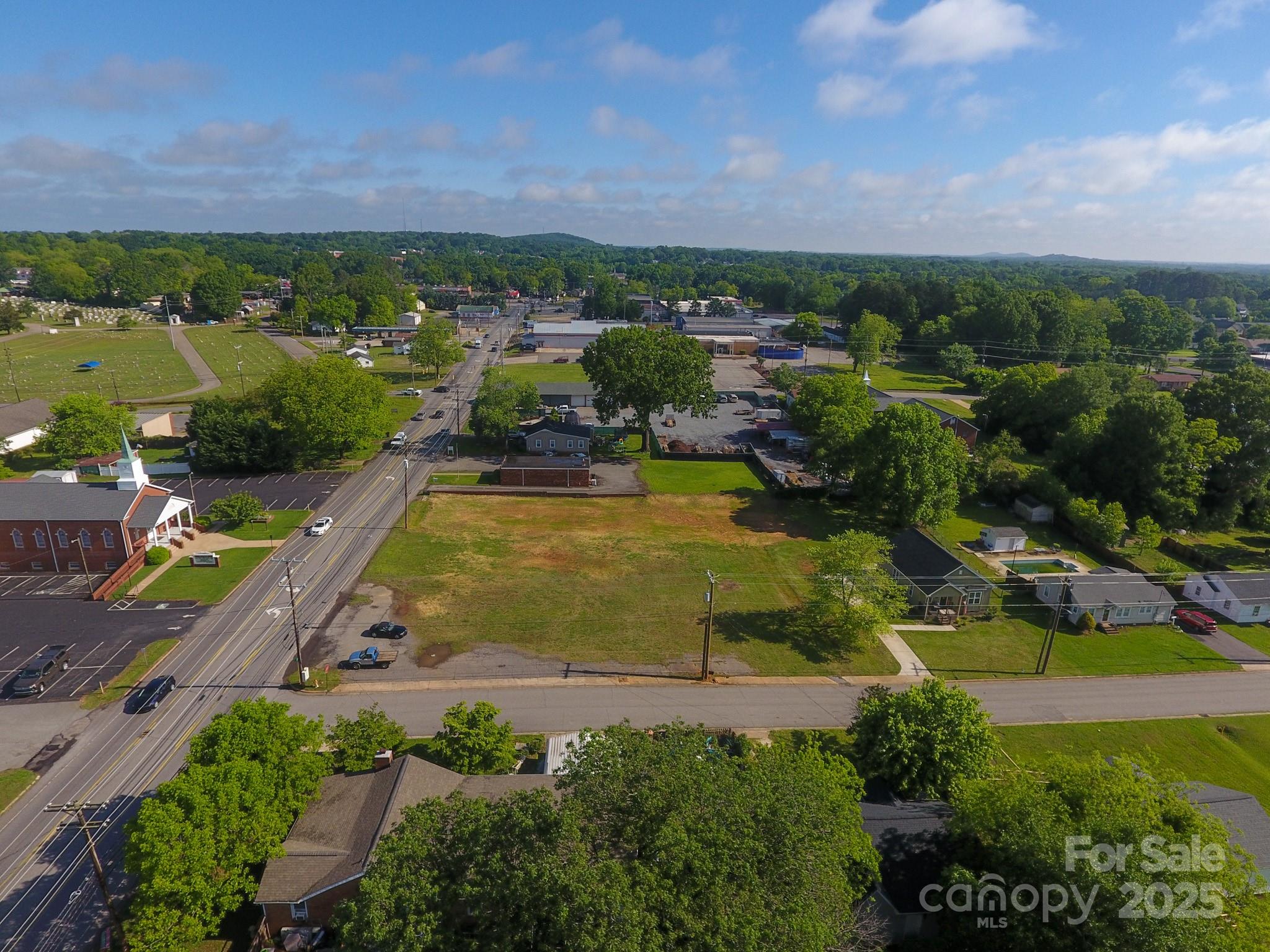 309 York Road Kings Mountain, NC 28086 - Photo 2 of 9 an aerial view of residential houses with outdoor space and swimming pool