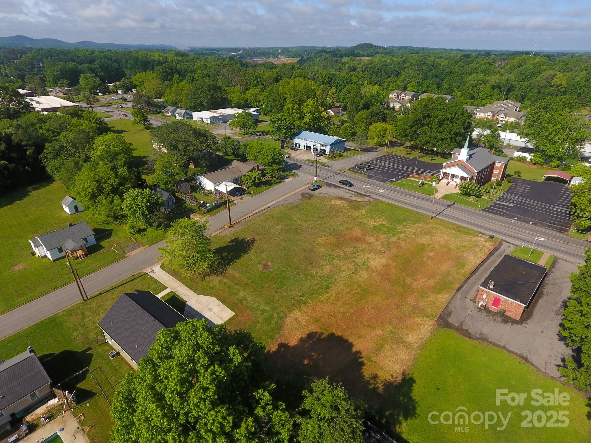 309 York Road Kings Mountain, NC 28086 - Photo 5 of 9 an aerial view of residential houses with outdoor space