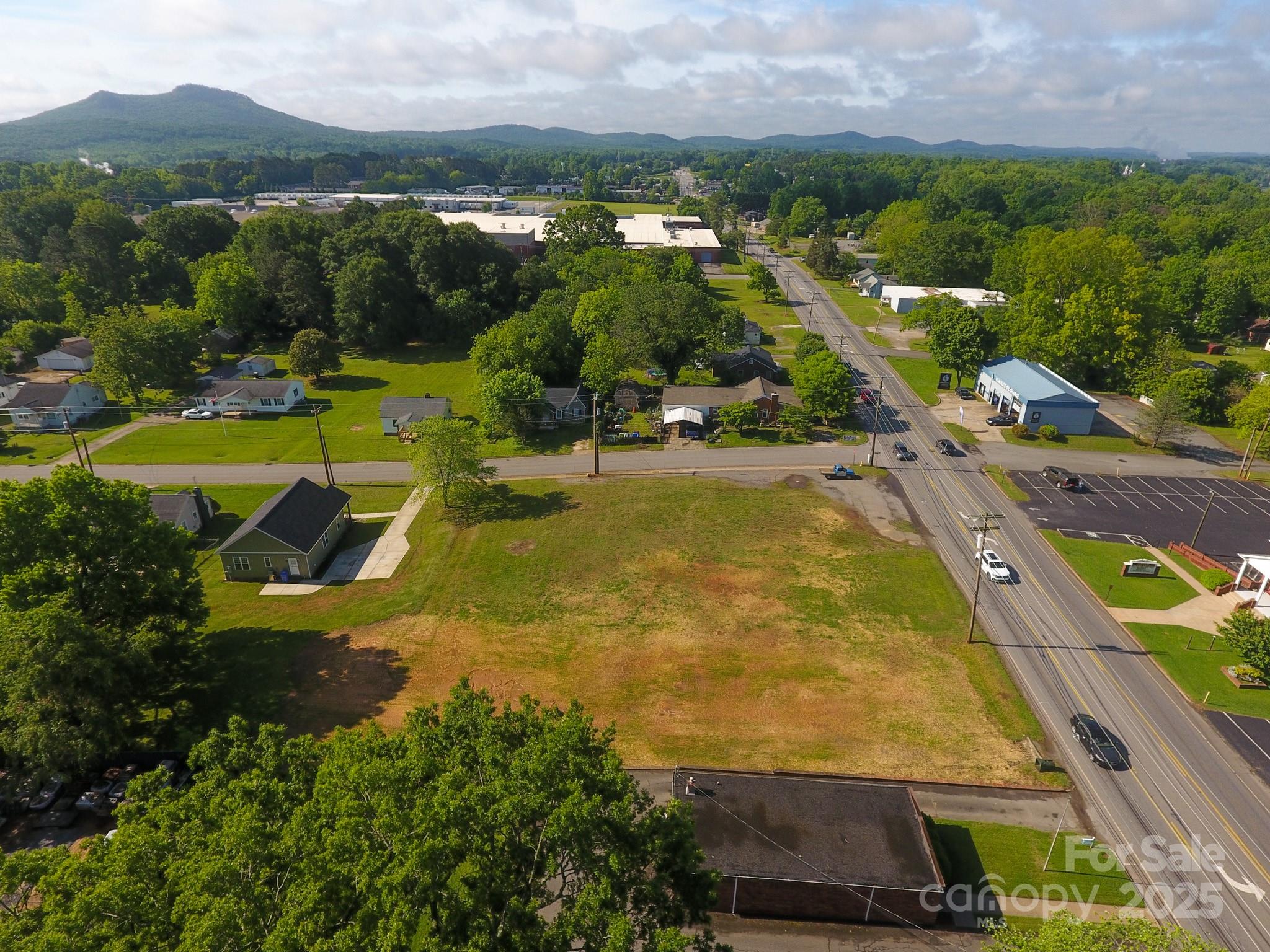 309 York Road Kings Mountain, NC 28086 - Photo 6 of 9 an aerial view of residential houses with outdoor space and a swimming pool