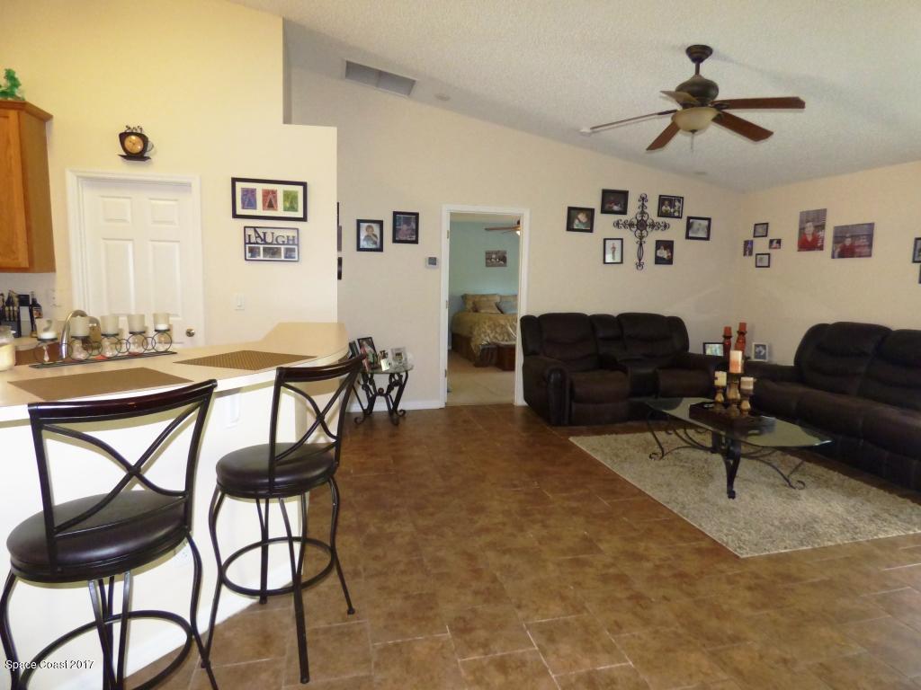 841 Garvey Road Palm Bay, FL 32908 - Photo 13 of 27 Breakfast Bar & Family Room