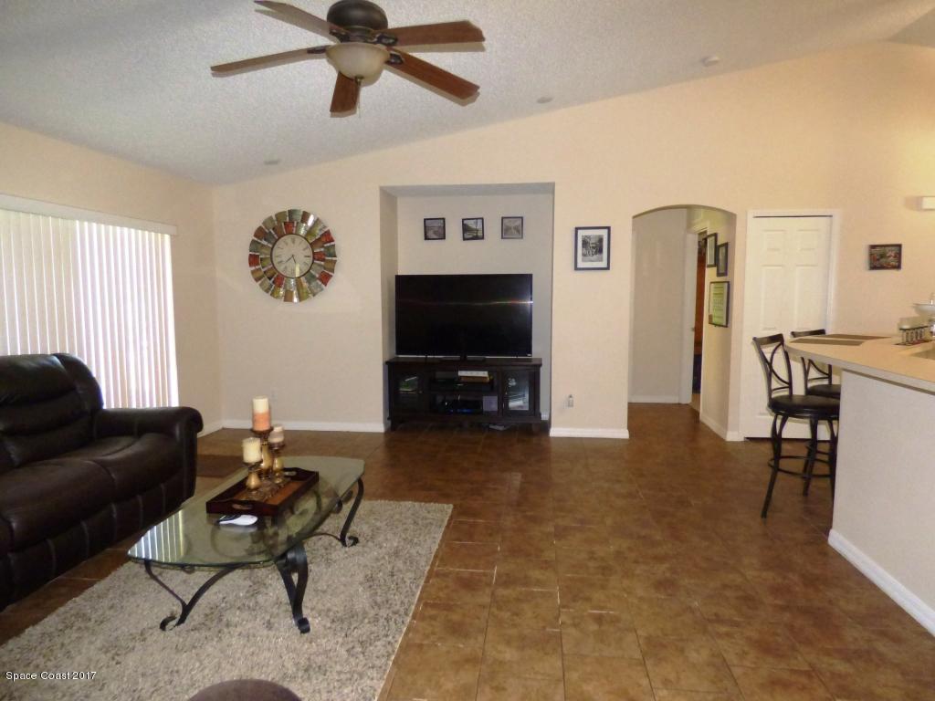 841 Garvey Road Palm Bay, FL 32908 - Photo 14 of 27 Family Room Vaulted Ceilings