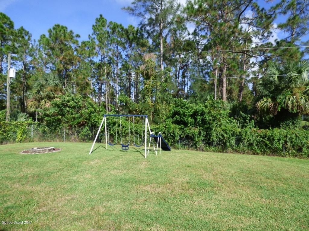 841 Garvey Road Palm Bay, FL 32908 - Photo 25 of 27 Swingset & Fire Pit