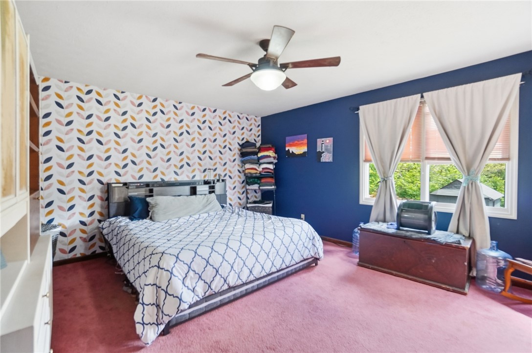 5209 North Addison New Carlisle Road St. Paris, OH 43072 - Photo 22 of 47 This spacious bedroom offers comfortable living with ample natural light.
