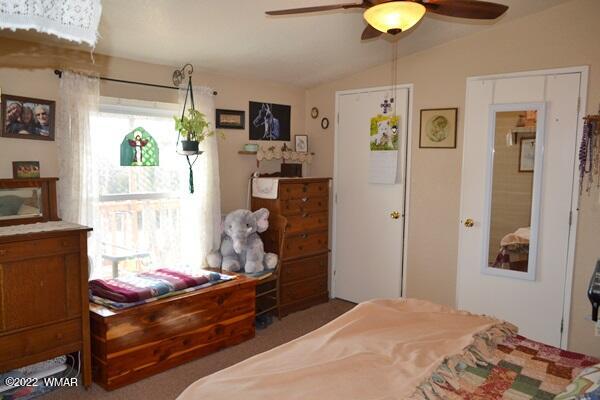 4915 Jack Rabbit Road Snowflake, AZ 85937 - Photo 13 of 56 a bedroom with a bed and a flat tv screen