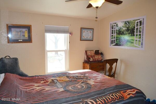 4915 Jack Rabbit Road Snowflake, AZ 85937 - Photo 19 of 56 a bedroom with a bed and a window