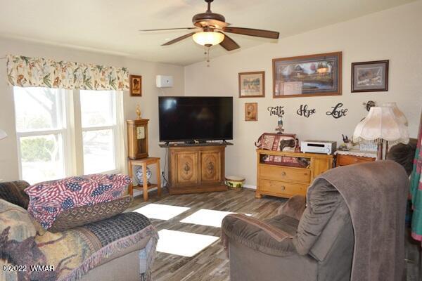 4915 Jack Rabbit Road Snowflake, AZ 85937 - Photo 2 of 56 a living room with furniture and a flat screen tv