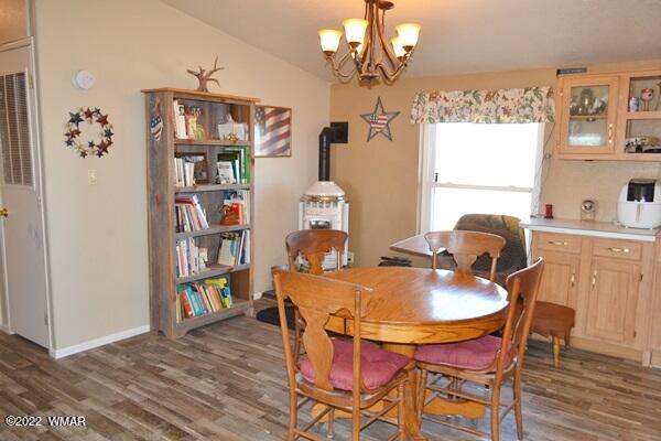4915 Jack Rabbit Road Snowflake, AZ 85937 - Photo 3 of 56 a dining room with furniture and chandelier