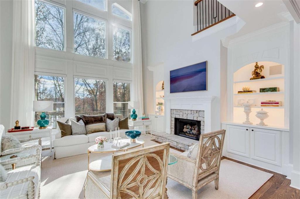 6226 Random Winds Bluff Gainesville, GA 30506 - Photo 12 of 76 a living room with furniture a fireplace and a large window