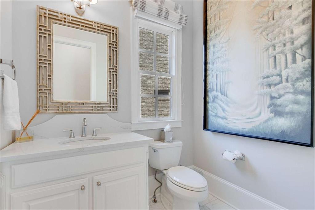 6226 Random Winds Bluff Gainesville, GA 30506 - Photo 29 of 76 a bathroom with a sink and a mirror