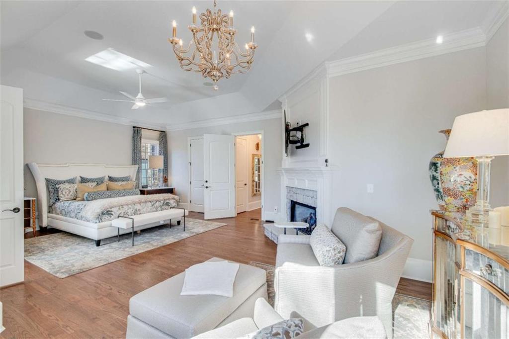 6226 Random Winds Bluff Gainesville, GA 30506 - Photo 32 of 76 a living room with furniture and a chandelier
