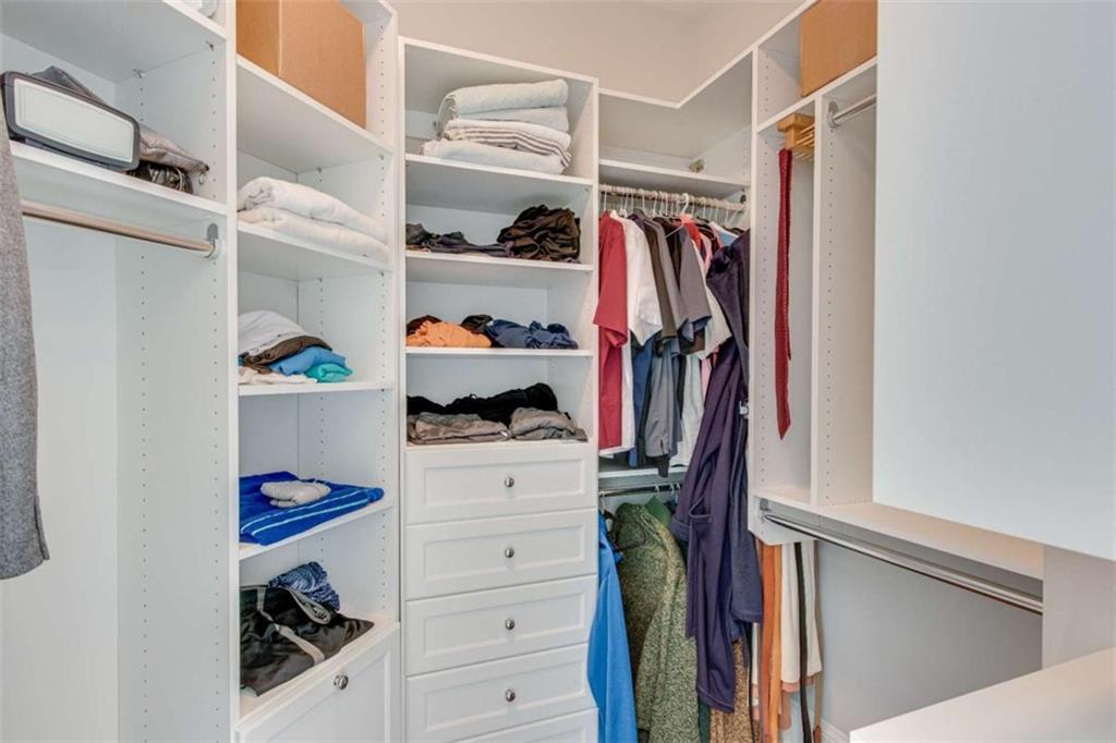 6226 Random Winds Bluff Gainesville, GA 30506 - Photo 36 of 76 a view of walk in closet with clothes and shoes