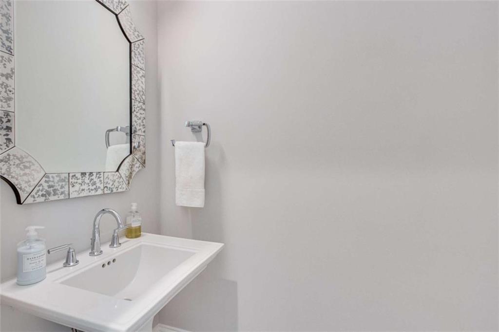 6226 Random Winds Bluff Gainesville, GA 30506 - Photo 37 of 76 a bathroom with a sink and a mirror