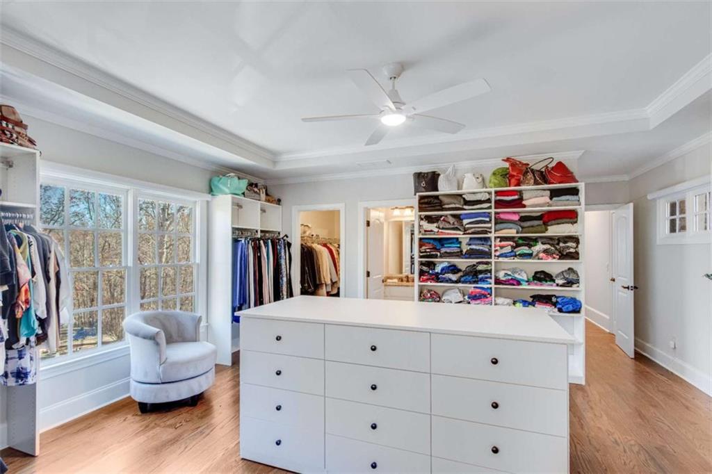 6226 Random Winds Bluff Gainesville, GA 30506 - Photo 47 of 76 a living room with furniture and a book shelf