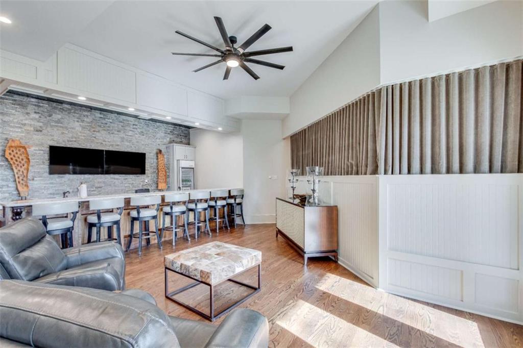 6226 Random Winds Bluff Gainesville, GA 30506 - Photo 55 of 76 a living room with furniture and a flat screen tv