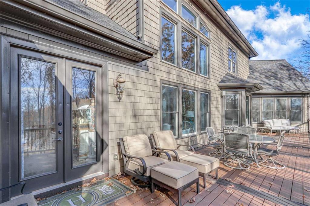 6226 Random Winds Bluff Gainesville, GA 30506 - Photo 61 of 76 a view of a patio with couple of chairs and a table