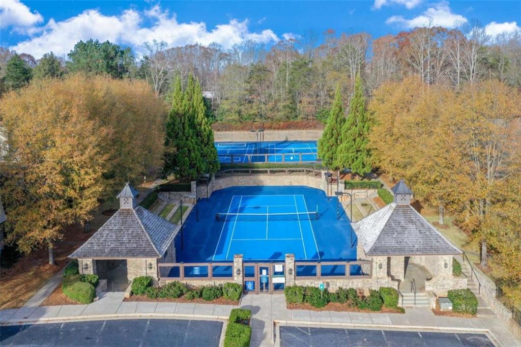 6226 Random Winds Bluff Gainesville, GA 30506 - Photo 69 of 76 a aerial view of a house with swimming pool and a yard