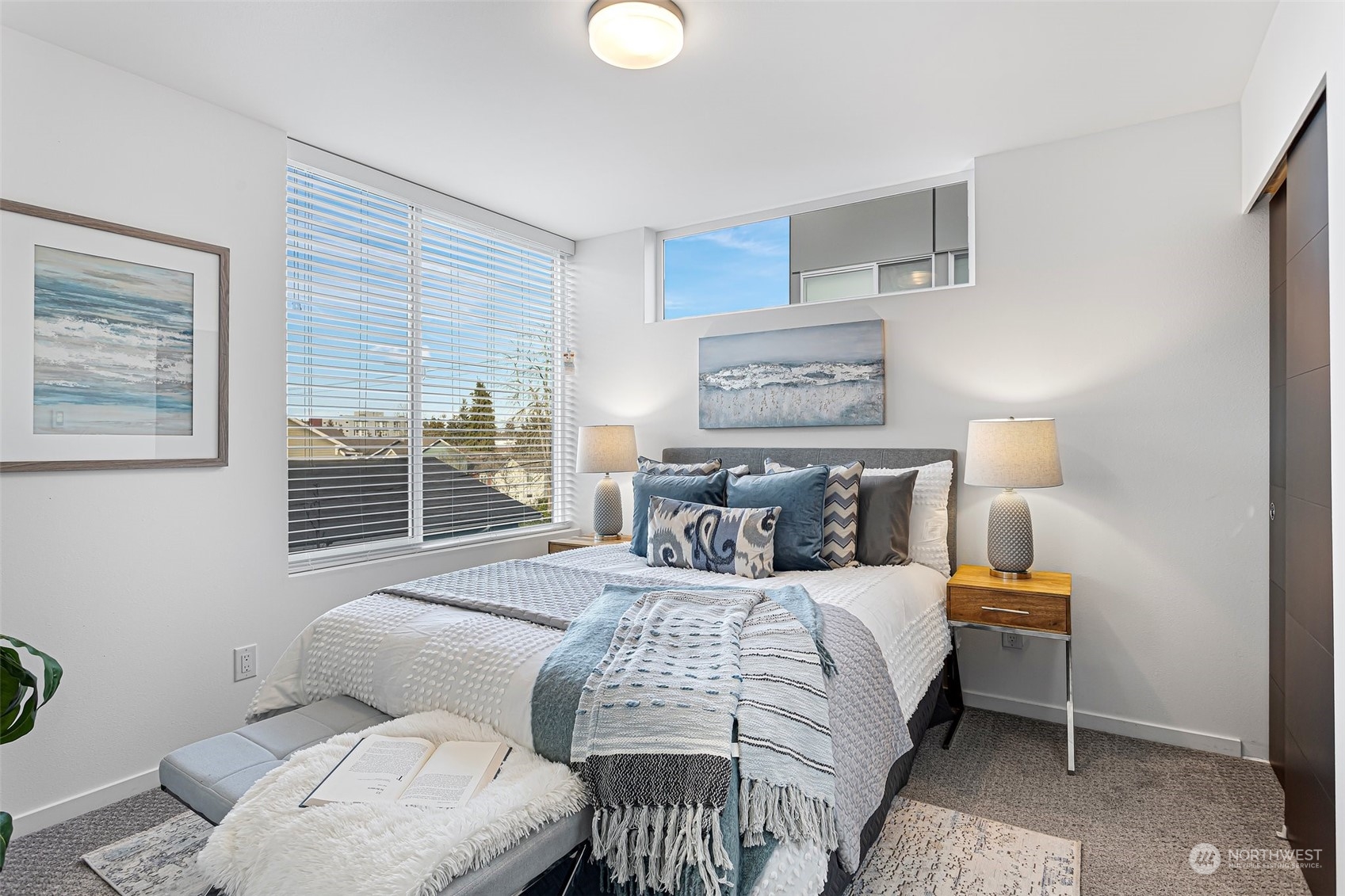 9221 Linden Avenue North, Unit B Seattle, WA 98103 - Photo 11 of 18 a bedroom with a bed and wooden floor