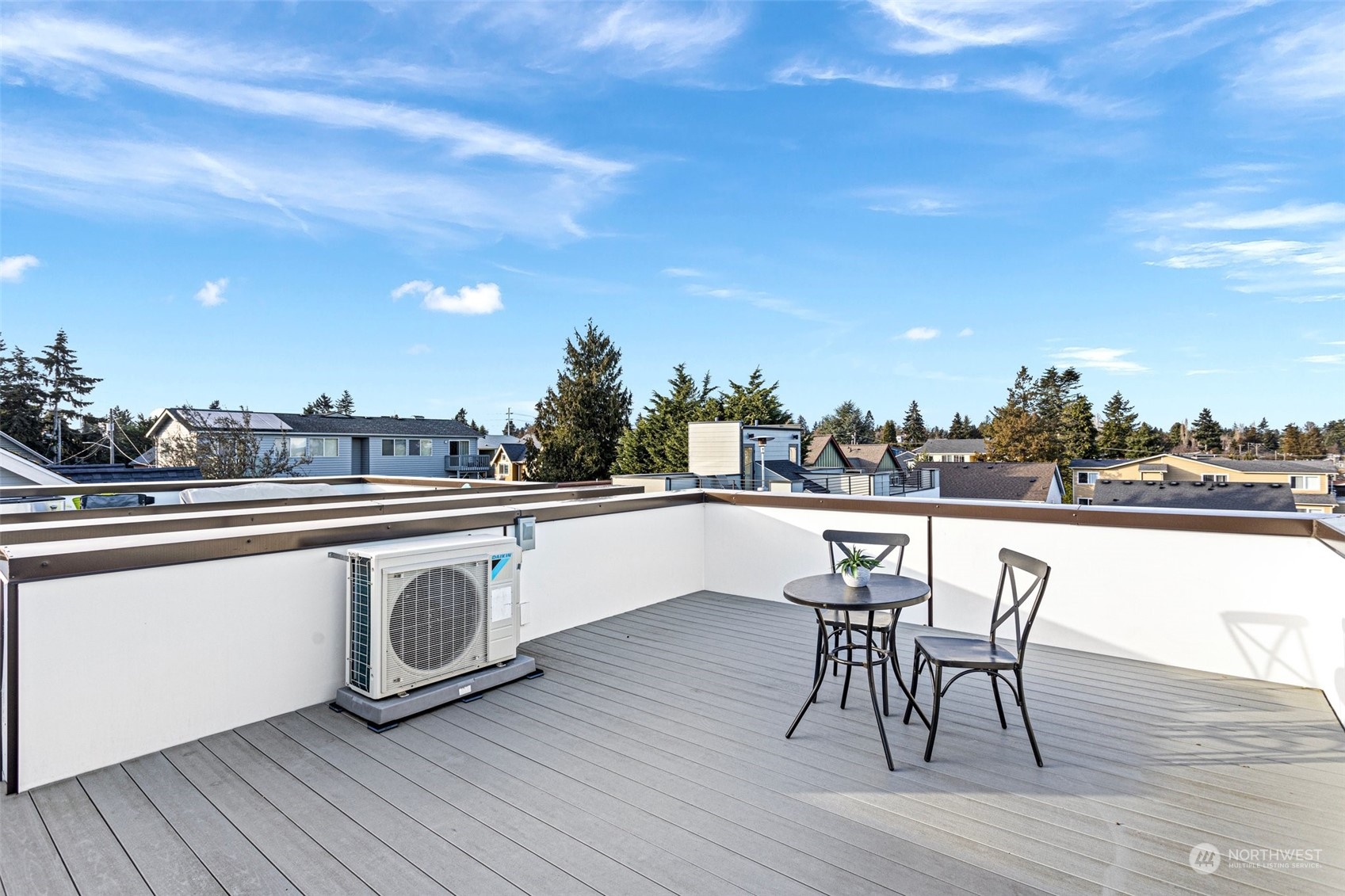 9221 Linden Avenue North, Unit B Seattle, WA 98103 - Photo 17 of 18 a terrace with outdoor seating and wooden floor