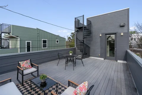 a backyard of a house with seating space