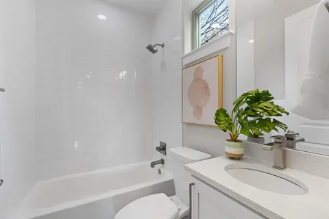 a bathroom with a sink a toilet and a bathtub