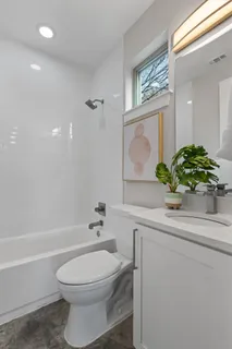 a bathroom with a sink a toilet and a bathtub