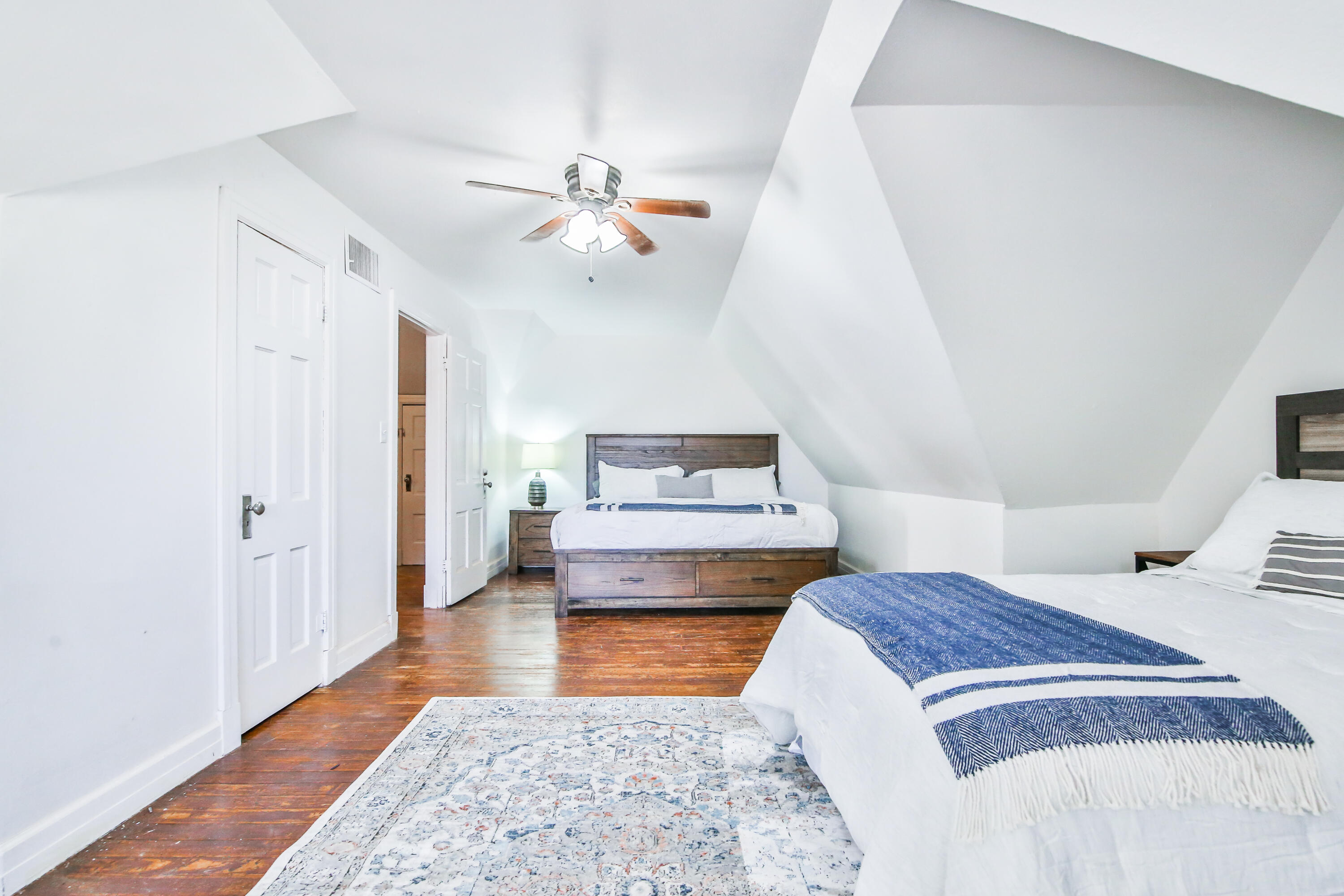 2309 17th Street Lubbock, TX 79401 - Photo 16 of 26 a bedroom with a bed and a chandelier