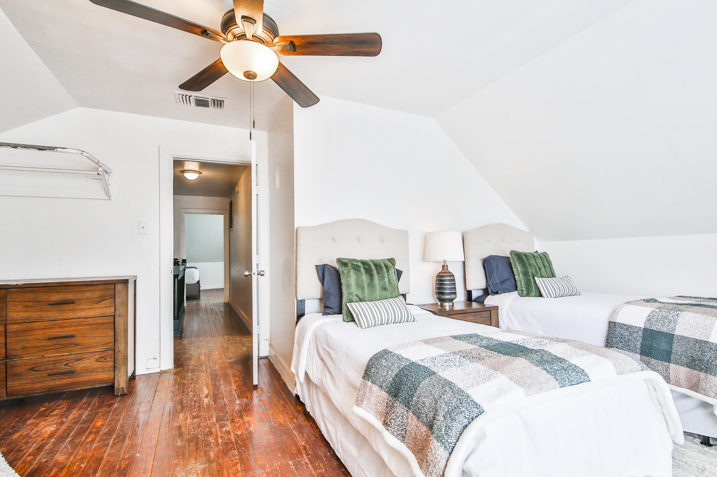 2309 17th Street Lubbock, TX 79401 - Photo 20 of 26 a bedroom with a bed and wooden floor