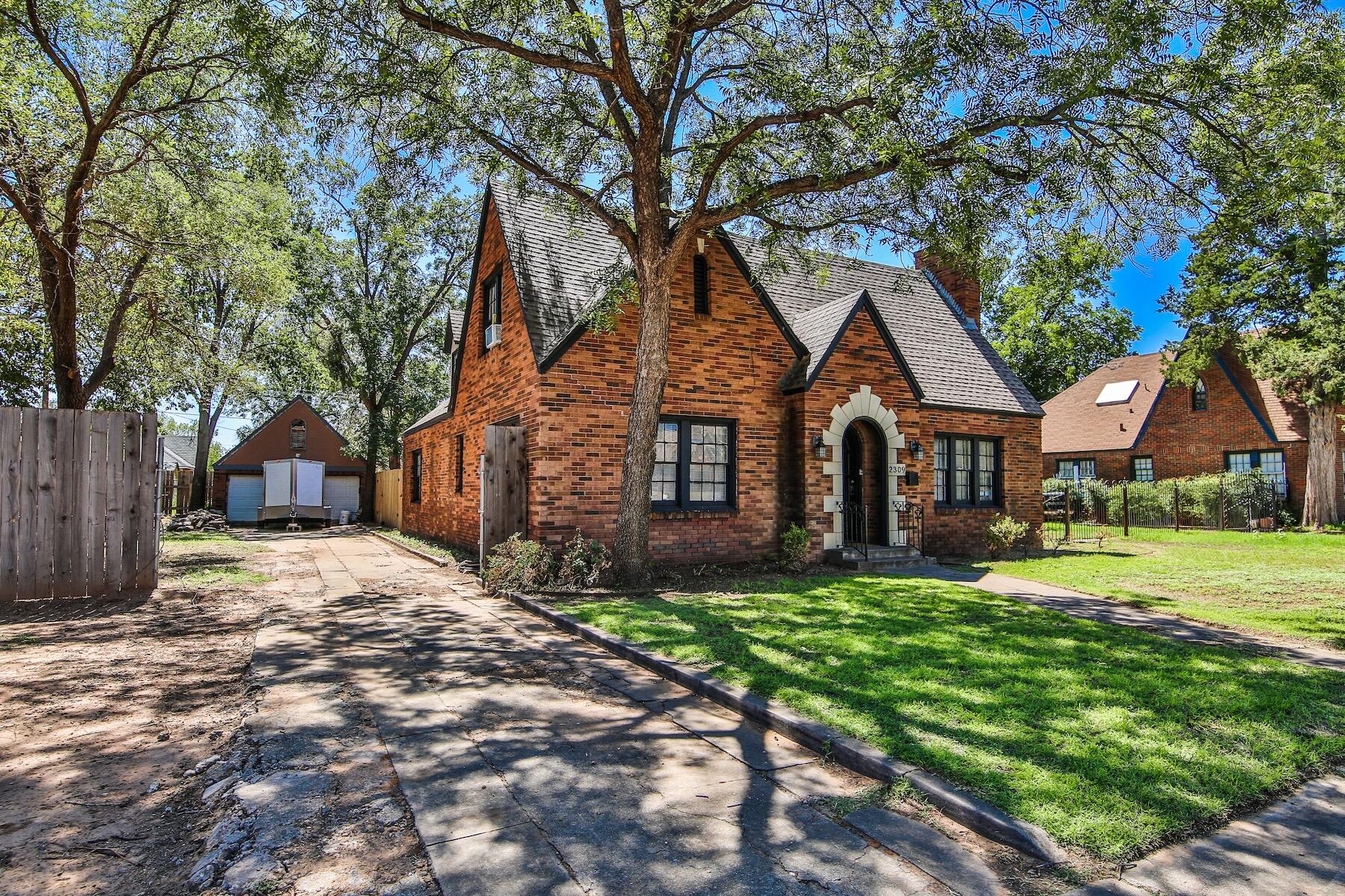 2309 17th Street Lubbock, TX 79401 - Photo 2 of 26 a front view of a house with a yard