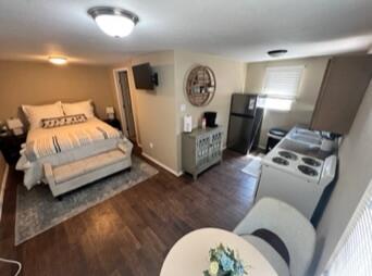 2309 17th Street Lubbock, TX 79401 - Photo 23 of 26 a bedroom with bed and a mirror